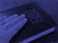 hand on the bible - christian powerpoint backgrounds